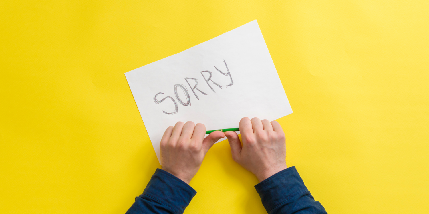 canva auf einem Zettel steht 'sorry'